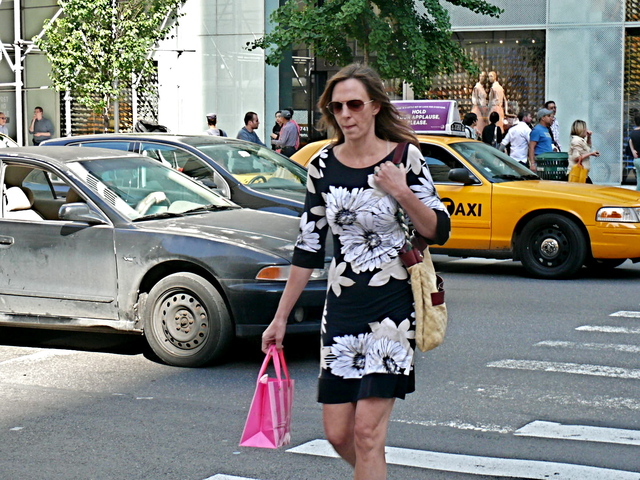 A mid-thigh dress with a large floral motif and watercolor camel details on Fifth Avenue Midtown.