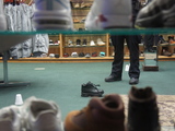 Shoe Store Guard Arrested After 12-Year-Old Boy Wounded in Gun Battle