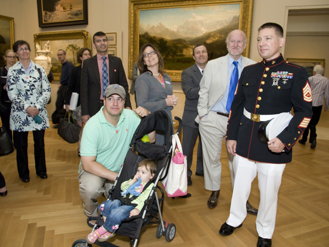 (R-L) Gunnery Sergeant Mark Butler and Creel Brown, Captain, U.S. Army and daughter Riley at the Blue Star Museums launch at The MET on May 22, 2012. 
