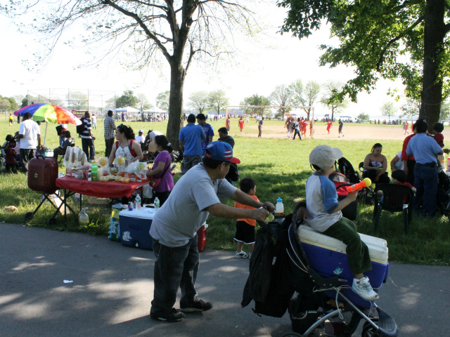 Fans hang out and watch the soccer games at Ferry Point Park on Saturday, May 19, 2012.