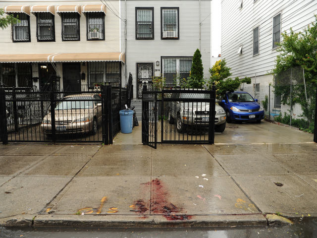 A pool of blood remains in front of 2814 West 15th Street in Brooklyn where a man was stabbed to death on Monday June 4th, 2012.