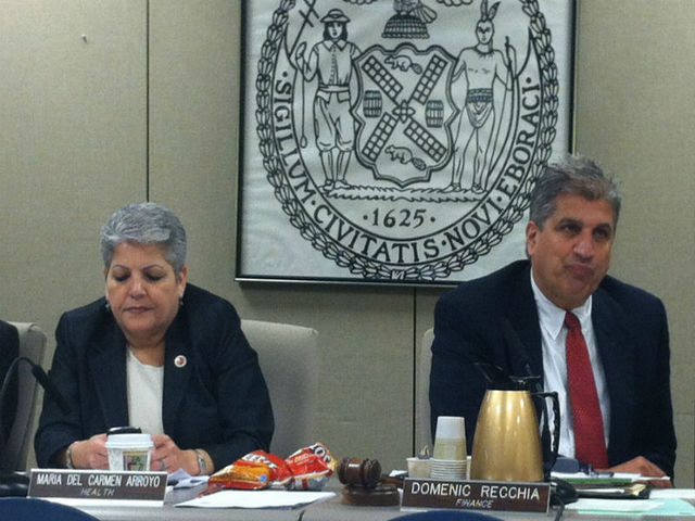 <p>Councilpeople Maria del Carmen Arroyo and Domenic Recchia nosh on some chips.</p>
