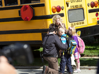 <p>Officials at the scene of a school bus crash in Queens on Tuesday June 5, 2012.</p>
