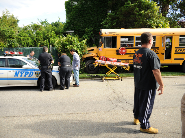 <p>The school bus ended up in the yard of 75-32 174th Street in Queens on Tuesday June 5, 2012.</p>
