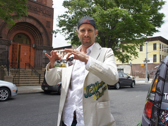 NuVo Condom representative Behn Goldis prepares to lead a safe sex assembly at Bedford Stuyvesant Preparatory High School in Brooklyn Tuesday. The company had initially partnered with principal Darryl Rascoe to give away 500 condoms to students for the school's prom Thursday night, but those plans were scuttled after blowback from the DOE.