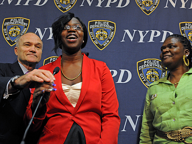 Police Commissioner for a Day essay winner Kanisha Ffriend is joined by her mother and Police Commissioner Raymond Kelly as she speaks to reporters after reading her essay at One Police Plaza, June 6, 2012. 