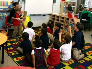 Students at the Academy of St. Joseph meet for a daily morning assembly.