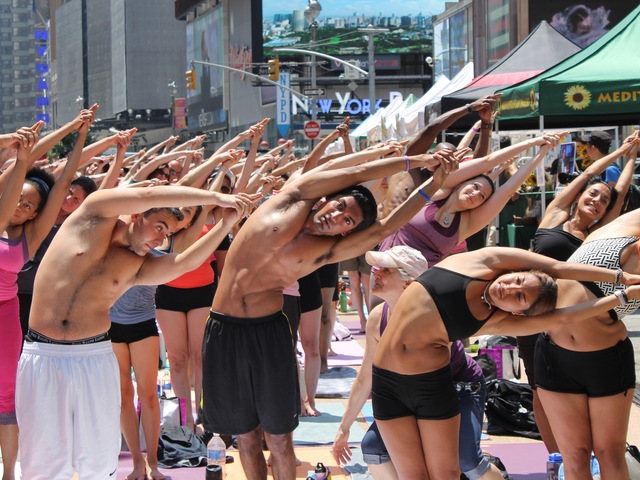 Thousands of yogis turned out for a free Bikram Yoga class in Times Square on June 20, 2012.