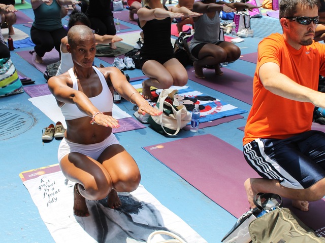 Thousands of yogis turned out for a free Bikram Yoga class in Times Square on June 20, 2012.