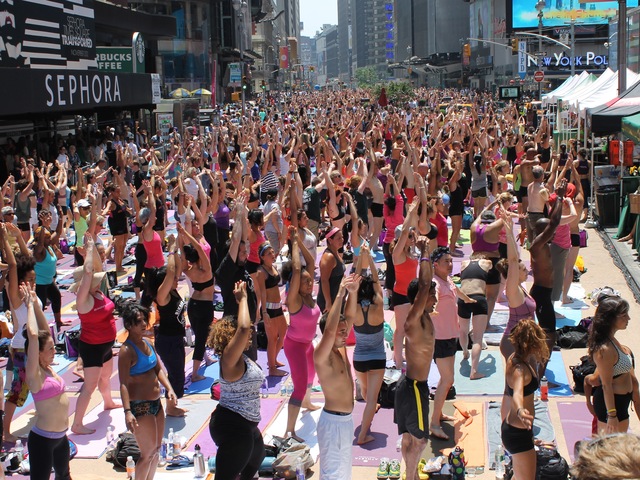 <p>More than 14,000 people turned out for the Bikram Yoga class celebrating the summer solstice on Wednesday June 20, 2012.</p>
