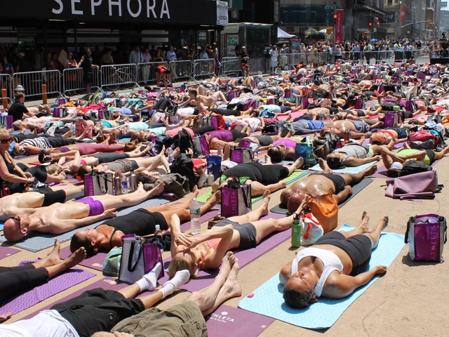 <p>More than 14,000 people turned out for the Bikram Yoga class celebrating the summer solstice on Wednesday June 20, 2012.</p>
