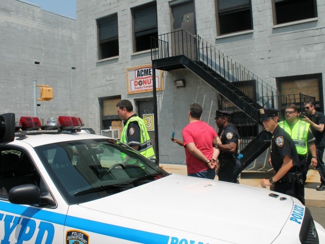 <p>Police act out arresting a man during an exercise that is used to train officers in appropriate conduct.</p>
