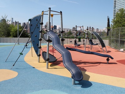 Gantry Plaza State Park Playground has a very modern design and is full of bright colors. 