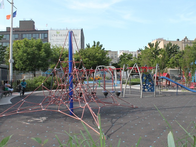 A spiderweb-like climbing structure at Murray Playground.