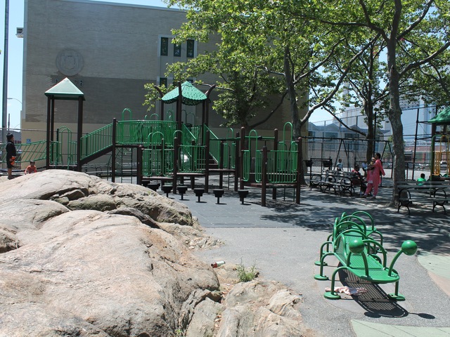 Spirit Playground has a jungle gym and a rock that children like to climb on.