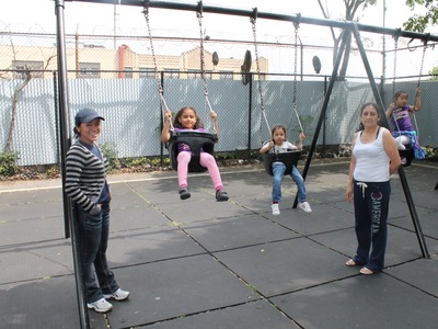 Juana Garcia (left) and her 5-year old daughter Joanna play at Playground Thirty Five XXXV
