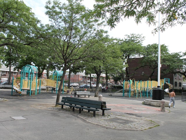 Raimonda Playground has several sitting areas with benches and game tables.