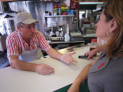 Dimitrios Alexiou, manager of Sam's Pizza told East harlem Councilwoman Melissa mark-Viverito he's providing goods the public wants. Often when he offers the 12 ounce fountain soda with pizza special, cutomers say it's too small.