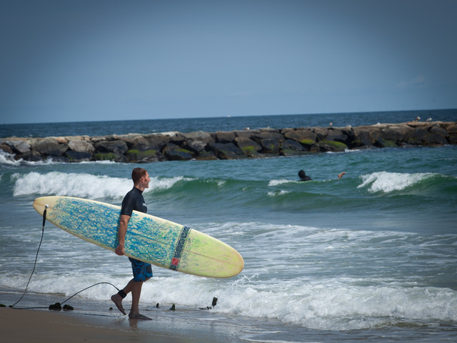 Surfing at Rockaway Beach.