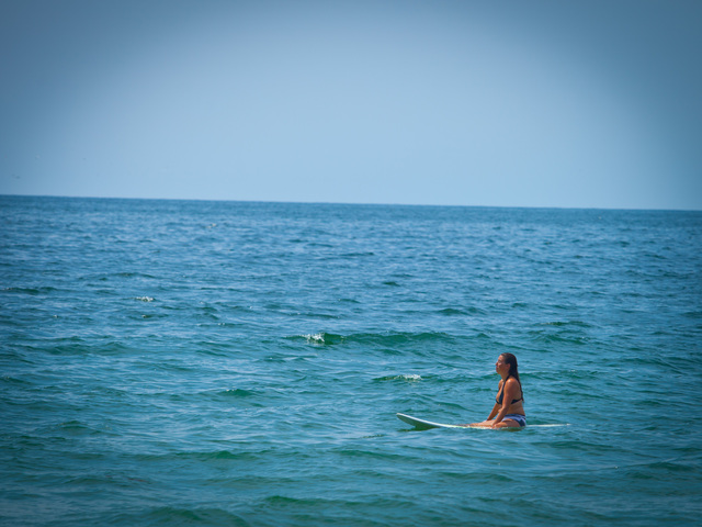 Relaxing in the water while surfing. 