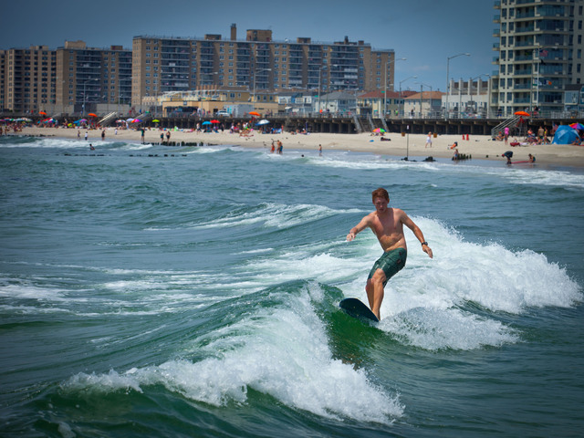 A surfer from California at Rockaway Beach on July 11. 