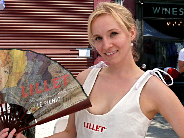 Kerri Ford shows off a Toulouse-Lautrec-style fan and monogrammed linen uniform.