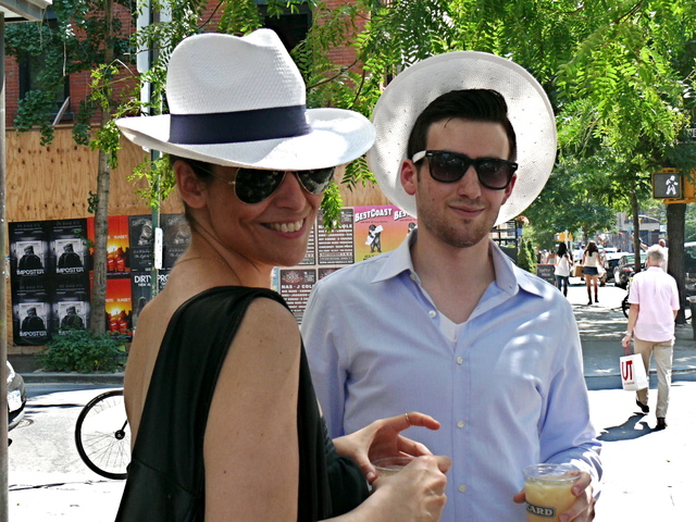 Very stylishly  incognito in jaunty white straw hats from Pernod Ricard.