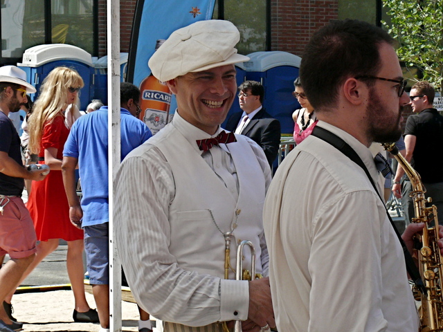 The always well-dressed Michael Arenella in white linen and striped linen pants.