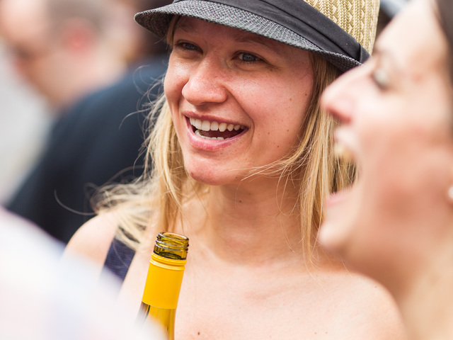 A young woman enjoys some French white wine at this Bastille Day celebration in Brooklyn on July 15th, 2012.