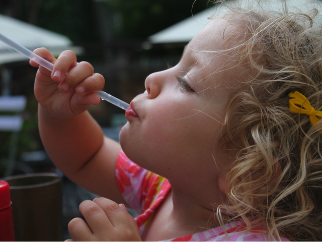 Sofia Carmona Young takes a sip of a cool drink on the deck at Maggie Brown in Fort Greene. 