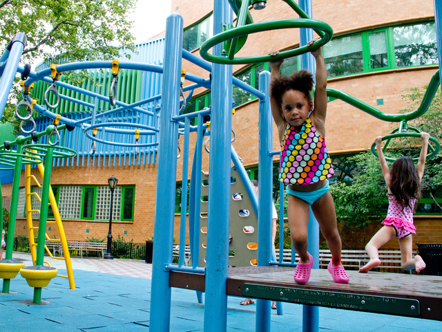 Kids wore bathing suits while playing at the Dekovats Playground while trying to cool off as the mercury hit 100 on July 18, 2012.