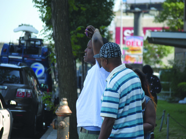 Outside Jamaica Hospital, friends and relatives of the victims consoled one another on July 22, 2012. 