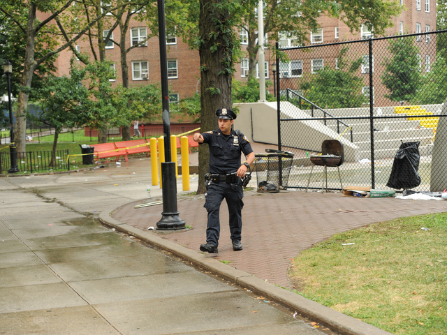 A Police Officer at the scene on East 165th Street where 4yr old Lloyd Morgan was killed on Monday July 23rd, 2012.