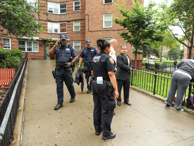 NYPD Evidence Collection Team outside of 735 East 165th Street in the Bronx where 4yr old Lloyd Morgan was killed late Sunday night on Monday July 23rd, 2012.