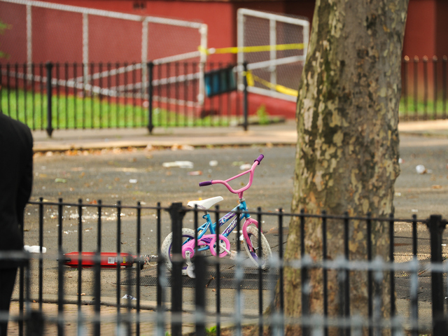 A bicycle can be seen on the playground where 4yr old Lloyd Morgan was shot and killed late Sunday night on Monday July 23rd, 2012.