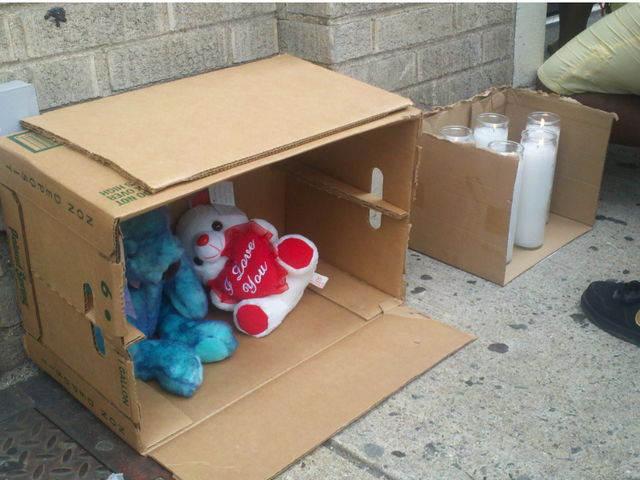 Mourners created a memorial for 4-year-old Lloyd Morgan, who was struck by a stray bullet and killed Sunday night, July 22, 2012.