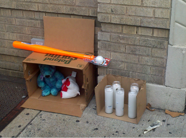 Toys, stuffed animals and candles were left at a memorial for 4-year-old Lloyd Morgan Monday, July 23, 2012.