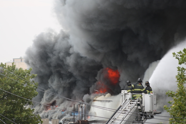 Firefighters battle a blaze at 3250 Fulton St.