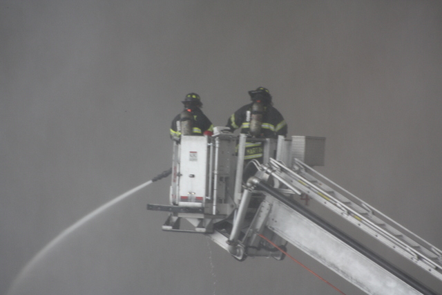 Firefighters battle the blaze at 3250 Fulton St.