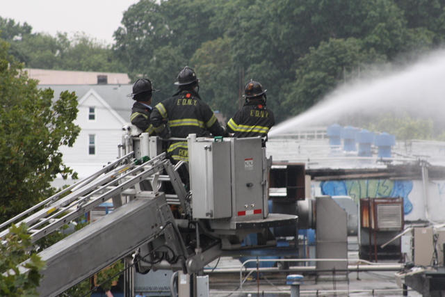 Service on the J train was suspended while firefighters battled a four-alarm blaze in Cypress Hills.