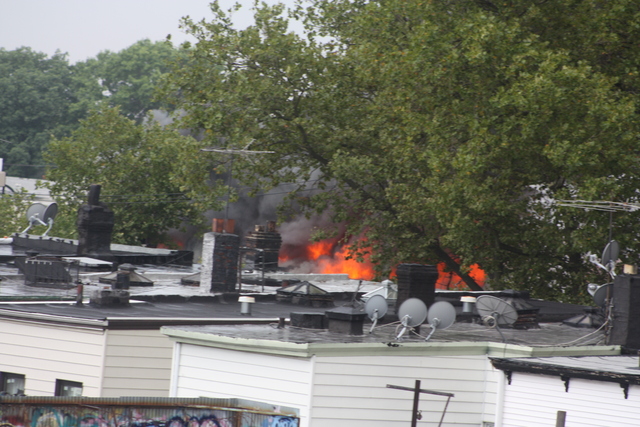 A five-alarm blaze broke out at 3250 Fulton St.. near the J train tracks. 