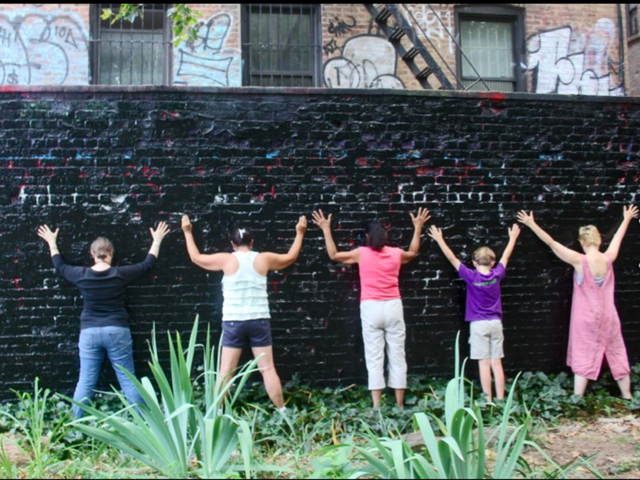 Inwood residents upset by the NYPD removal of a political Inwood mural staged a protest photo hours after it was removed on July 24, 2012.