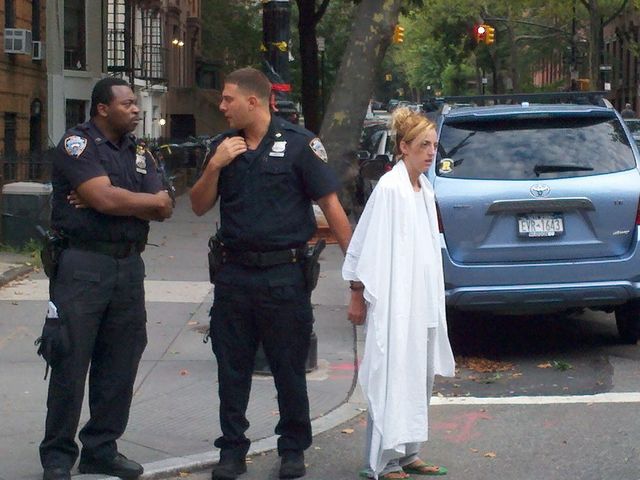 This woman allegedly attacked NY1 reporter Vivian Lee in Cobble Hill Friday morning, July 27, 2012. Police draped a blanket over her shoulders after the incident.