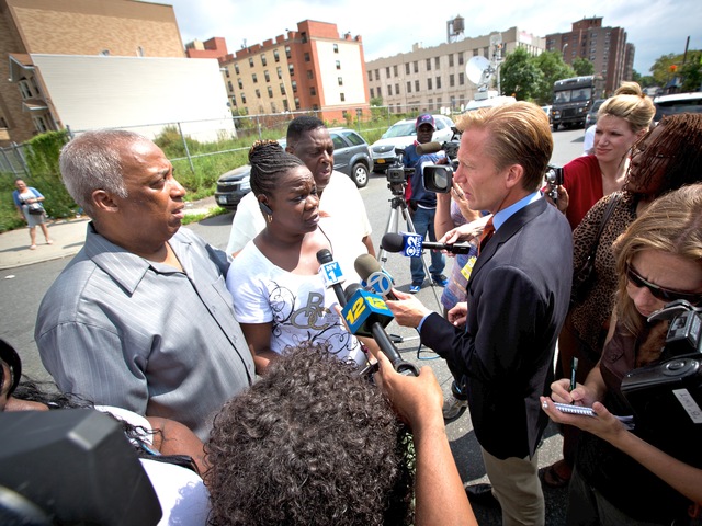 City Councilman Charles Barron meets with reporters a day after a 2-year-old girl was shot in Brownsville.
