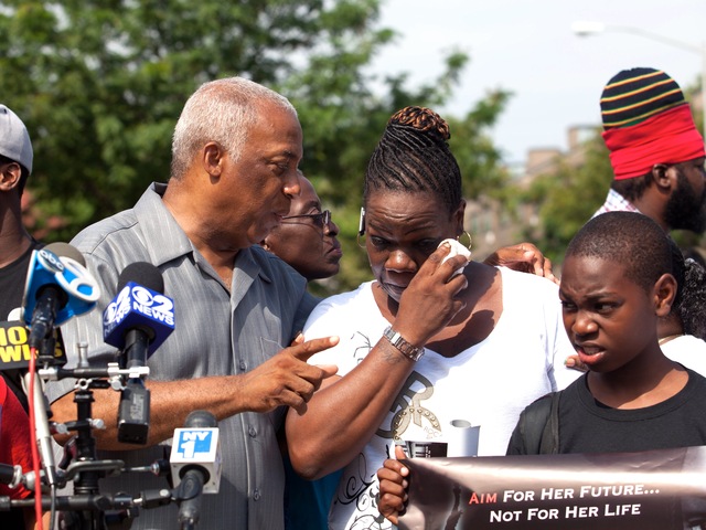 Leteria Hinton, with City Councilman Charles Barron, crying after her granddaughter, Ariyanna Prince, 2, was shot during a drive-by shooting in Brownsville on July 29, 2012.