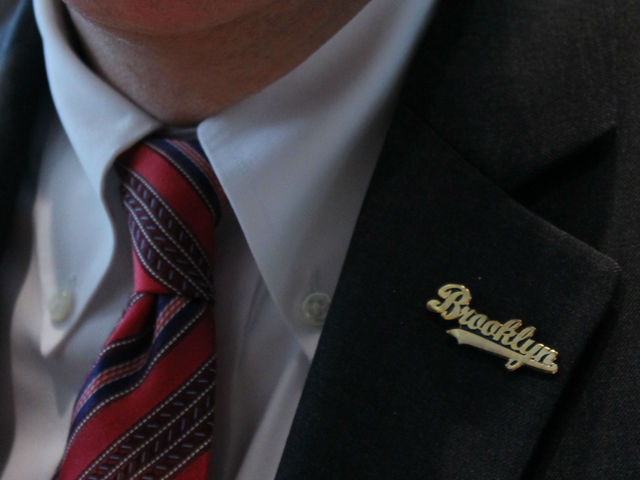 New York State Comptroller Thomas P. DiNapoli wears a Brooklyn pin