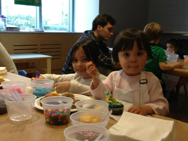 Kids decorate cupcakes in Asphalt Green Battery Park City's membership office, in one of the preview programs the community center has offered since its building has not opened. 