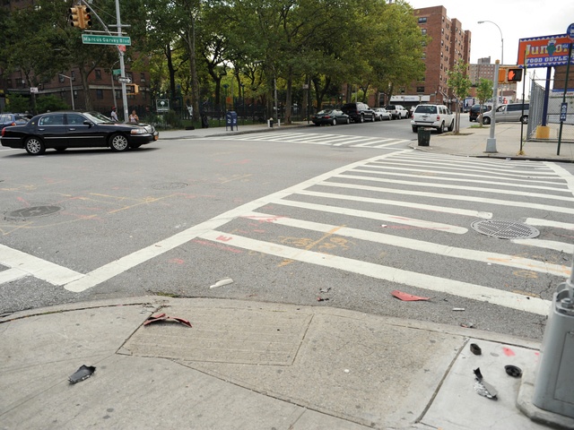 A motorcyclists was stuck at the intersection of Marcus Garvey Boulevard and Myrtle Avenue in Brooklyn on August 6, 2012. The driver of the car then fled the scene.