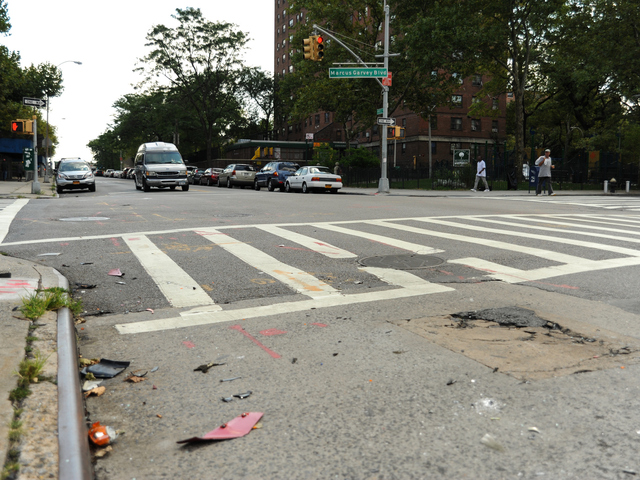 A motorcyclist was stuck at the intersection of Marcus Garvey Boulevard and Myrtle Avenue in Brooklyn on August 6, 2012. The driver of the car then fled the scene.