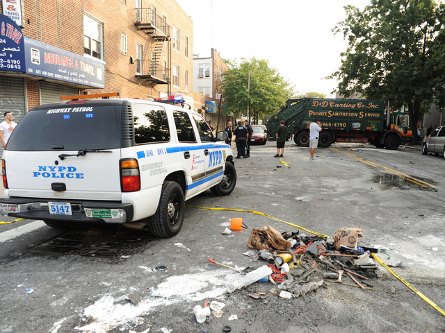 Debris from the crash littered the street Wednesday, Aug. 8, 2012.
